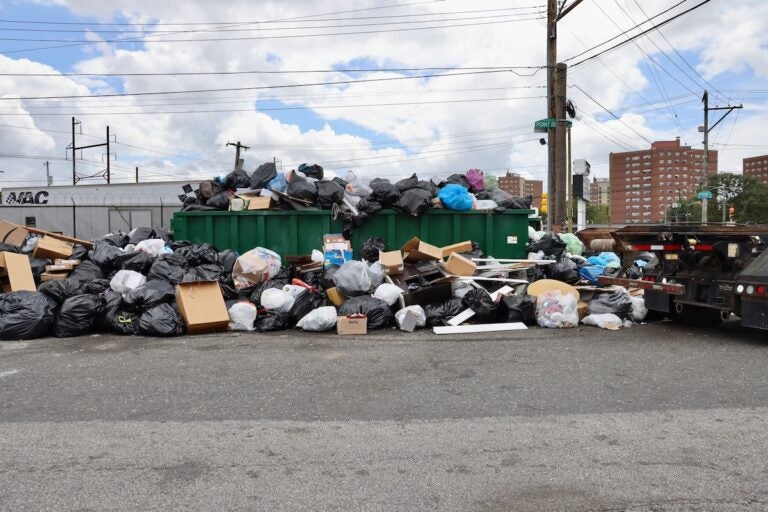 Trash overflows the dumpsters at the intersection of Snyder and Point Breeze avenues
