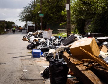 Trash spilled out of temporary dumpsters onto Wyalusing Ave