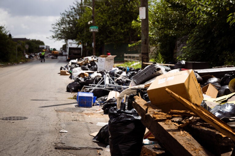 Trash spilled out of temporary dumpsters onto Wyalusing Ave
