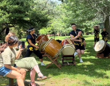 People watch a demonstration of taiko drumming