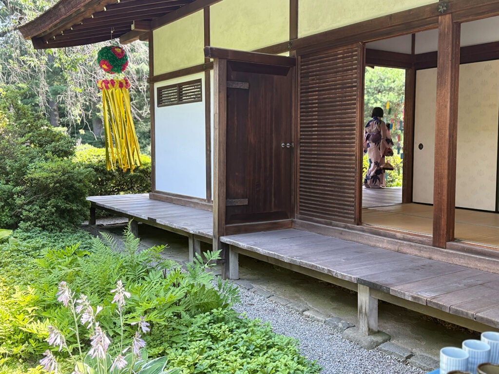 Visitors dressed in traditional Japanese kimonos tour the Shofuso house in Philadelphia