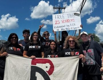 People at a rally holding up signs