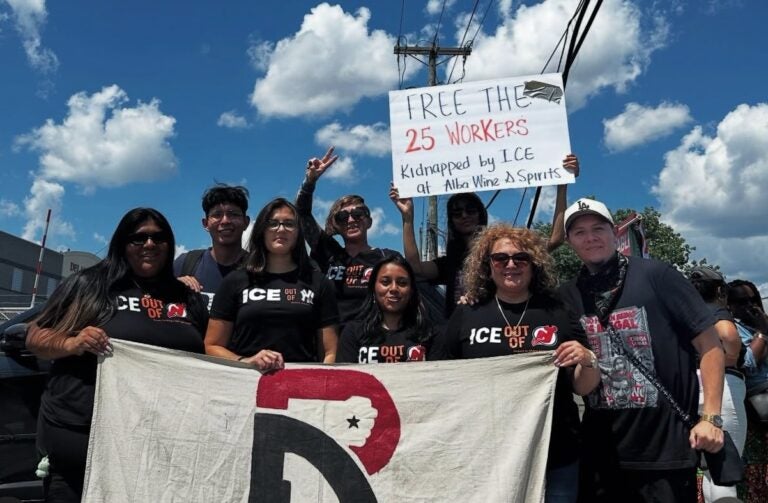 People at a rally holding up signs