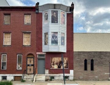 The windows of the Tanner House with pictures on them
