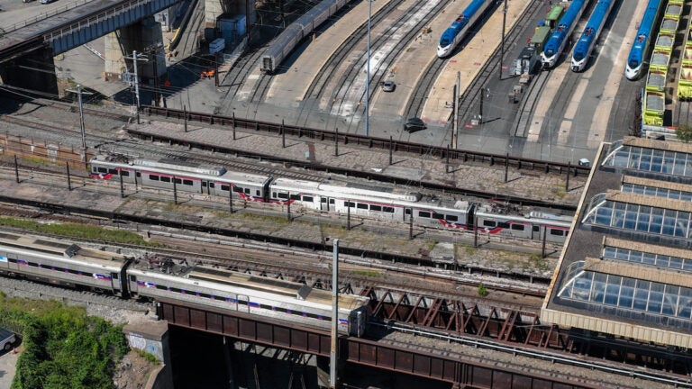 SEPTA regional rail trains entering and exiting 30th Street station in Philadelphia.