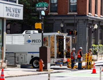 Workers congregate around a PECO truck