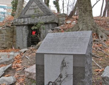 A likeness of Walt Whitman is carved on a memorial marker near his grave site in Camden