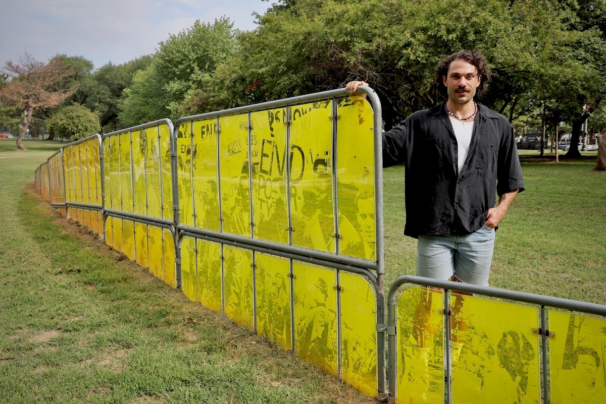 Nicolo Gentile standing next to section of Bar None installation