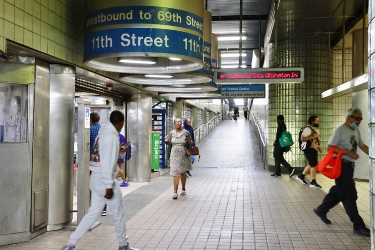 People milling about in the interchange hallway of a SEPTA station