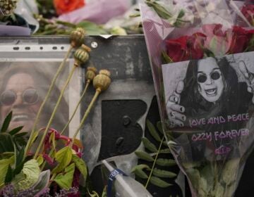 Flowers and messages are left by fans to commemorate the death of Ozzy Osbourne