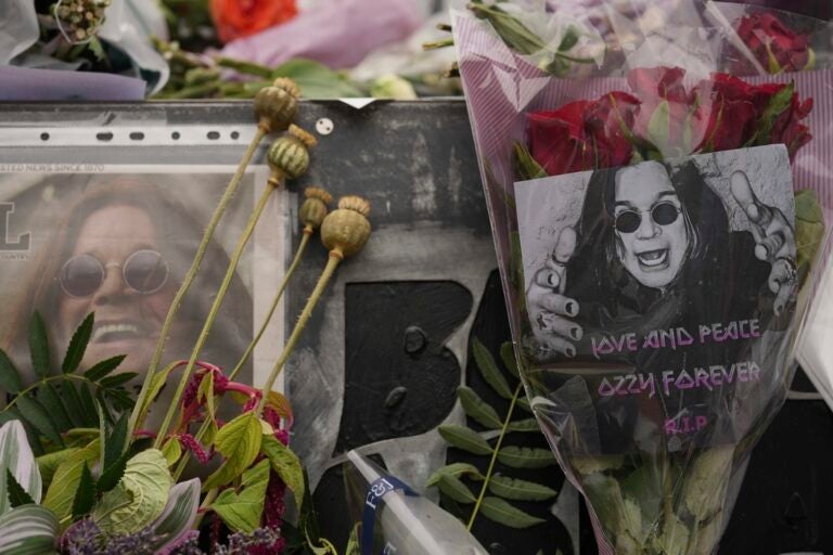 Flowers and messages are left by fans to commemorate the death of Ozzy Osbourne