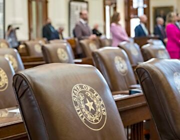 Empty chairs belonging to House Democrats remain empty during session convocation in the State Capitol, Tuesday, Aug. 5, 2025, in Austin, Texas. (AP Photo/Rodolfo Gonzalez)