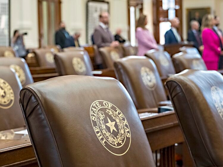 Empty chairs belonging to House Democrats remain empty during session convocation in the State Capitol, Tuesday, Aug. 5, 2025, in Austin, Texas. (AP Photo/Rodolfo Gonzalez)