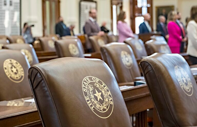 Texas Redistricting Empty chairs belonging to House Democrats remain empty during session convocation in the State Capitol, Tuesday, Aug. 5, 2025, in Austin, Texas. (AP Photo/Rodolfo Gonzalez)