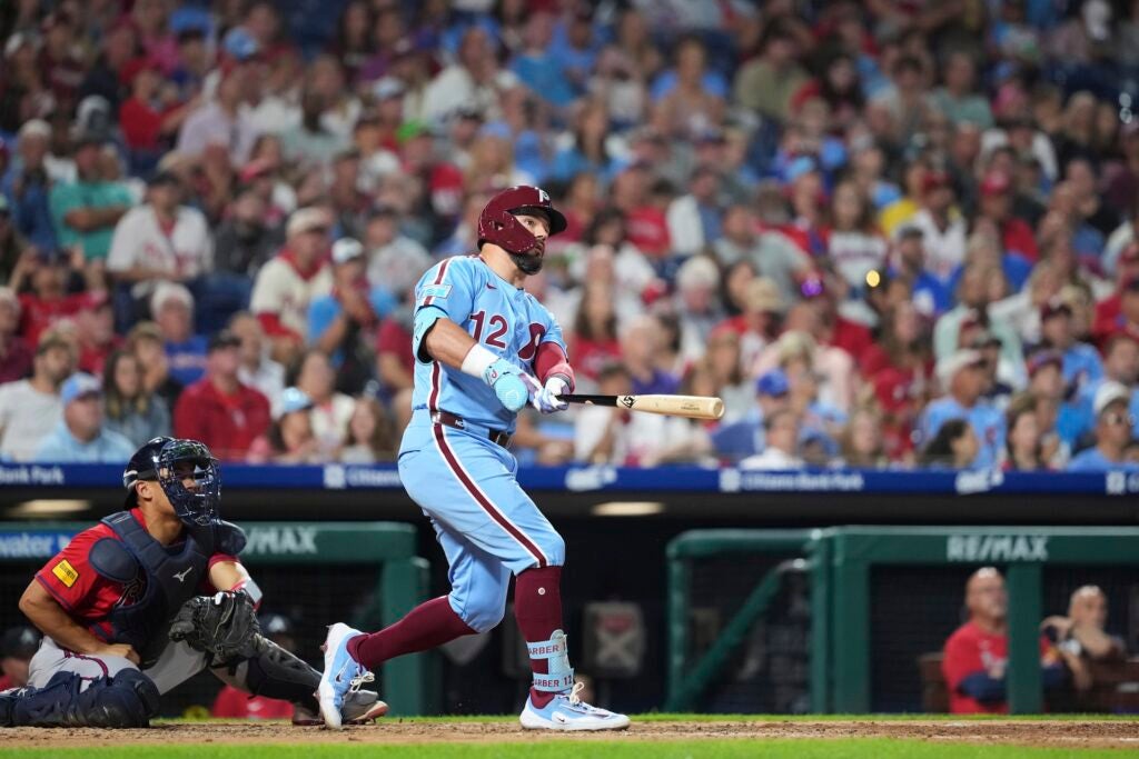 Kyle Schwarber watches after hitting a two-run home run
