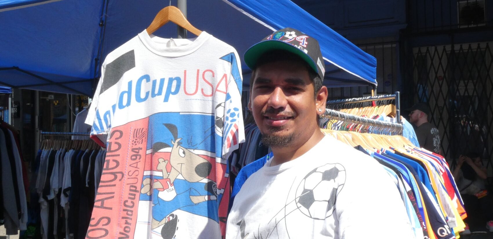 Jose Carbajal smiles by his stand