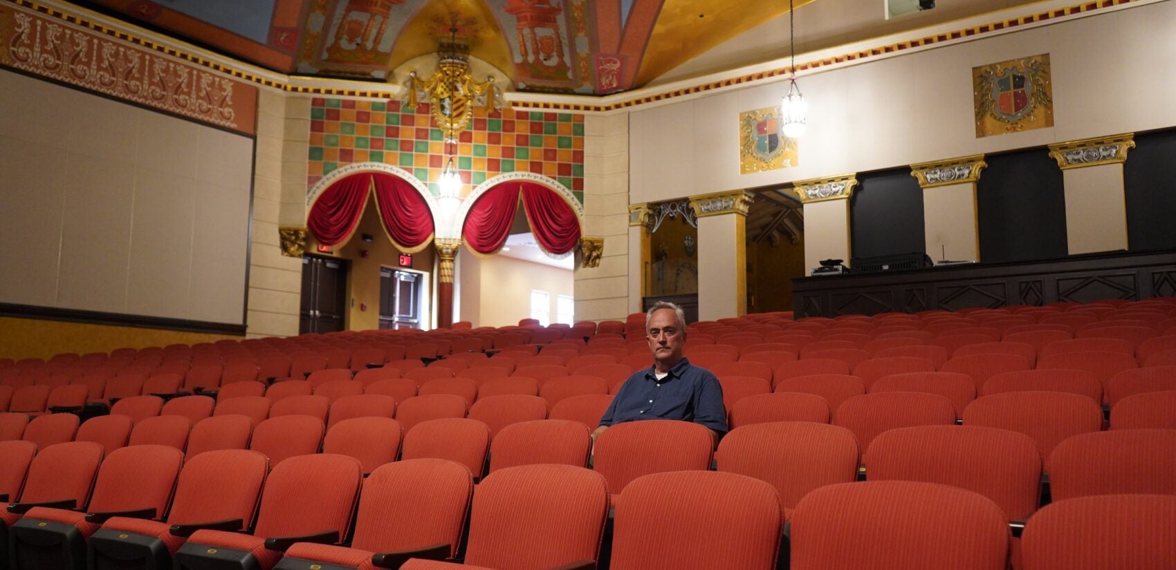 Matt Schultz, executive director of the Historic Lansdowne Theater Corporation, sits