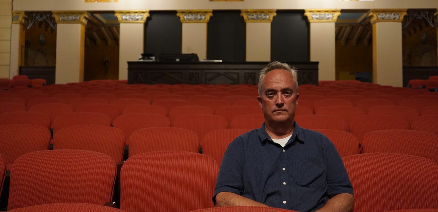 Matt Schultz, executive director of the Historic Lansdowne Theater Corporation, sits