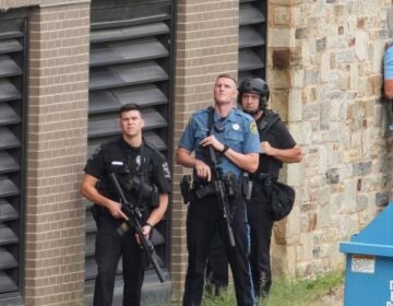Police gather at the Villanova University campus where an active shooter was reported Thursday, Aug. 21, 2025, in Villanova, Pa. (AP Photo/Matt Slocum)