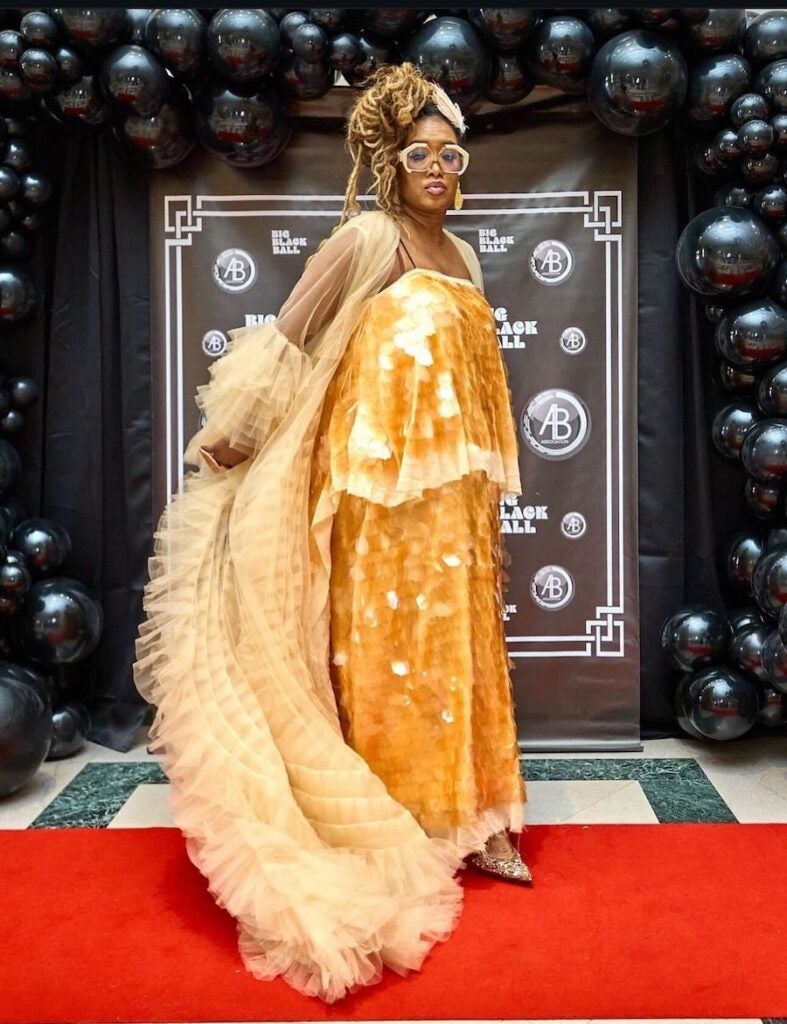 A woman in a fancy dress at a red carpet event
