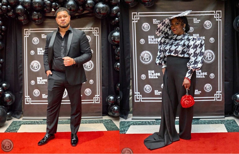 big_black_ball A man and woman in fancy clothes at a red carpet event