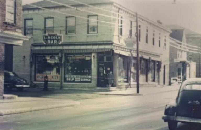 An old photo of the Lincoln Bar, at the corner of the street