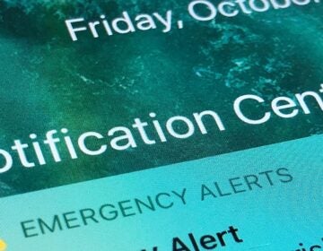 An emergency alert is displayed on a cellphone