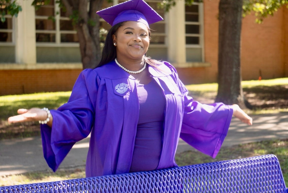 Esiyah Dixon-Waheed smiles after graduating college