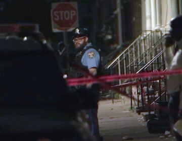 Police investigate a shooting scene in Philadelphia