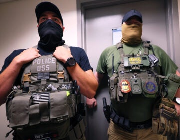 Immigration enforcement officials stand inside a criminal courthouse in New York City.