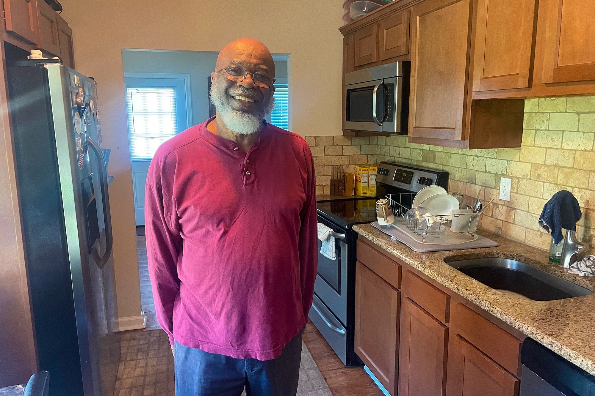 Jay Baylor posing for a photo in his home
