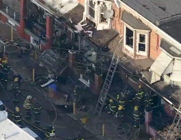 an aerial view of at least five Kensington homes damaged by a fire