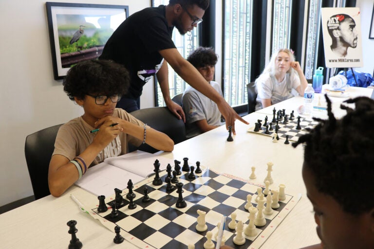 Black male youths play chess