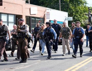 Police approach the school where the shooting occured
