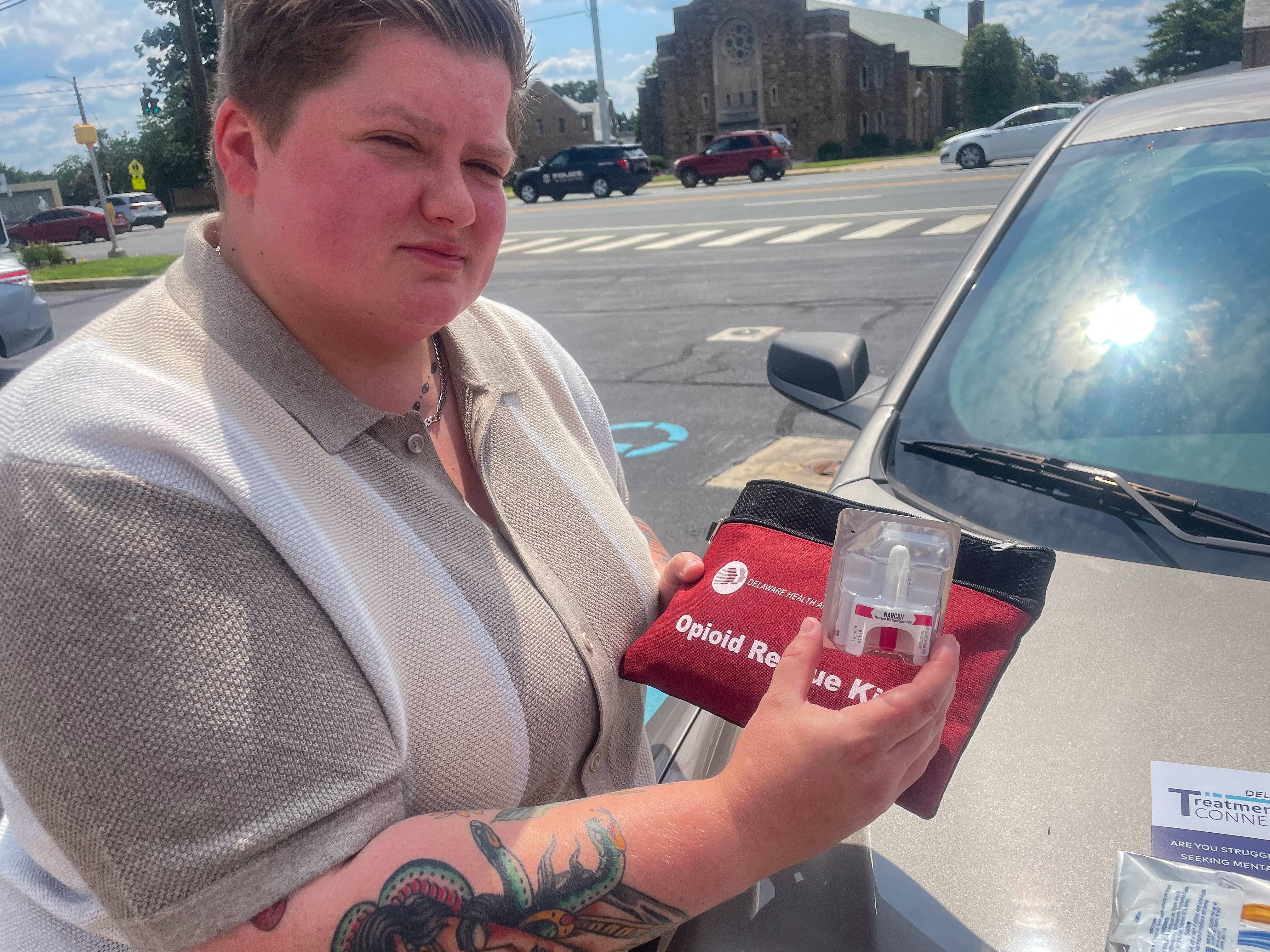 Chelsea Derryberry holding an opiod rescue kit