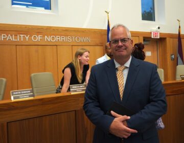 Michael Trail poses for a photo in the council chambers