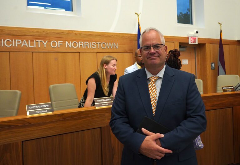 norristown-council-trail-k-cooper-2025-08-20-2 Michael Trail poses for a photo in the council chambers