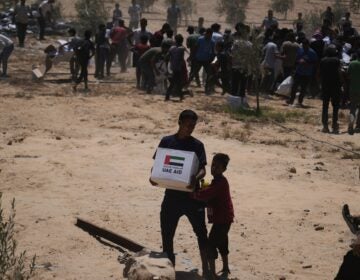 Palestinians collecting humanitarian aid packages