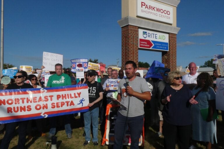 a person speaks at the SEPTA rally