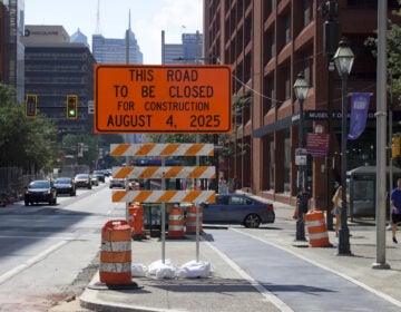 a sign on Market Street reads THIS ROAD TO BE CLOSED FOR CONSTRUCTION AUGUST 4, 2025