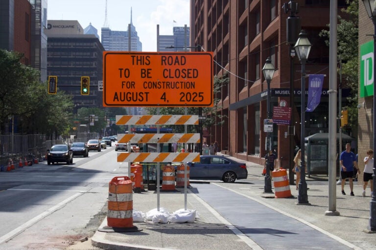 a sign on Market Street reads THIS ROAD TO BE CLOSED FOR CONSTRUCTION AUGUST 4, 2025