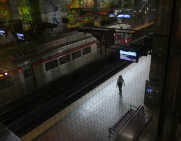 a person walks through a SEPTA Regional Rail station