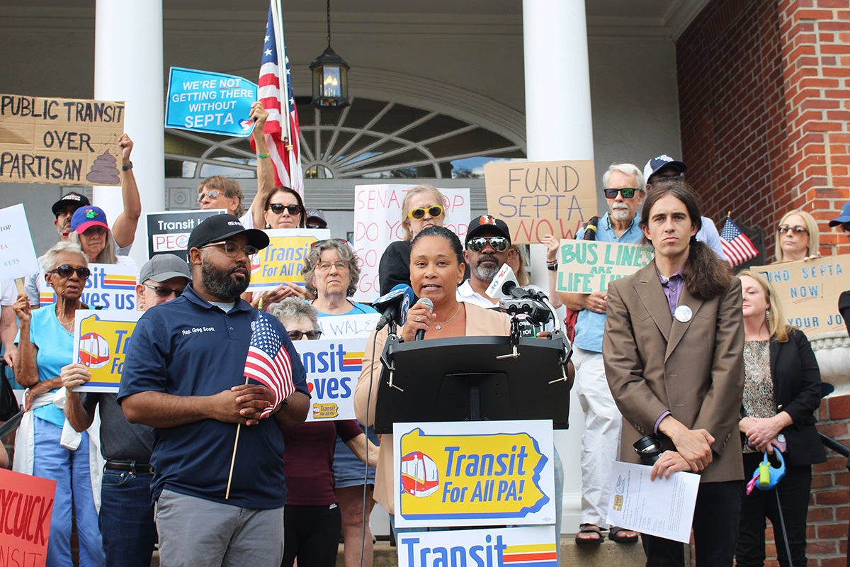 Jamila Winder speaks in front of SEPTA funding rallygoers