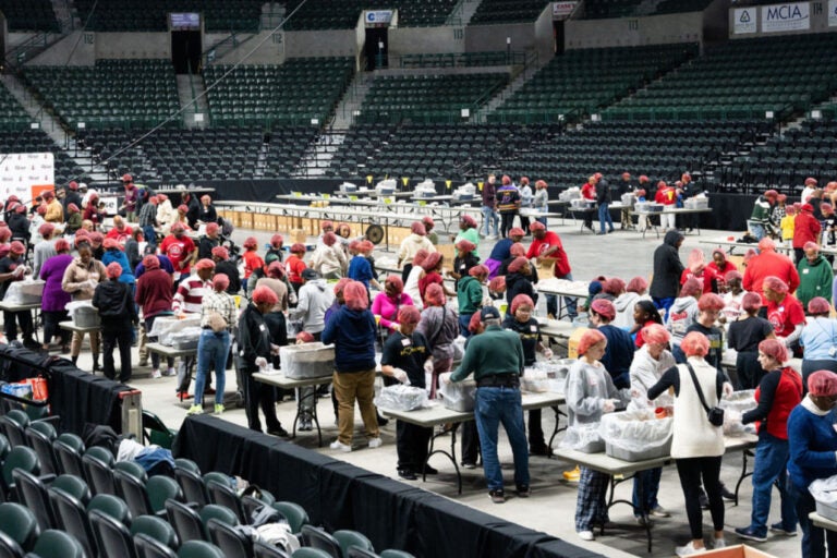 volunteers packing food