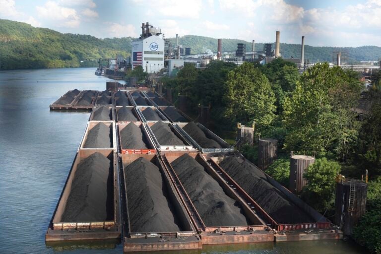 A factory sitting right on the banks of a river