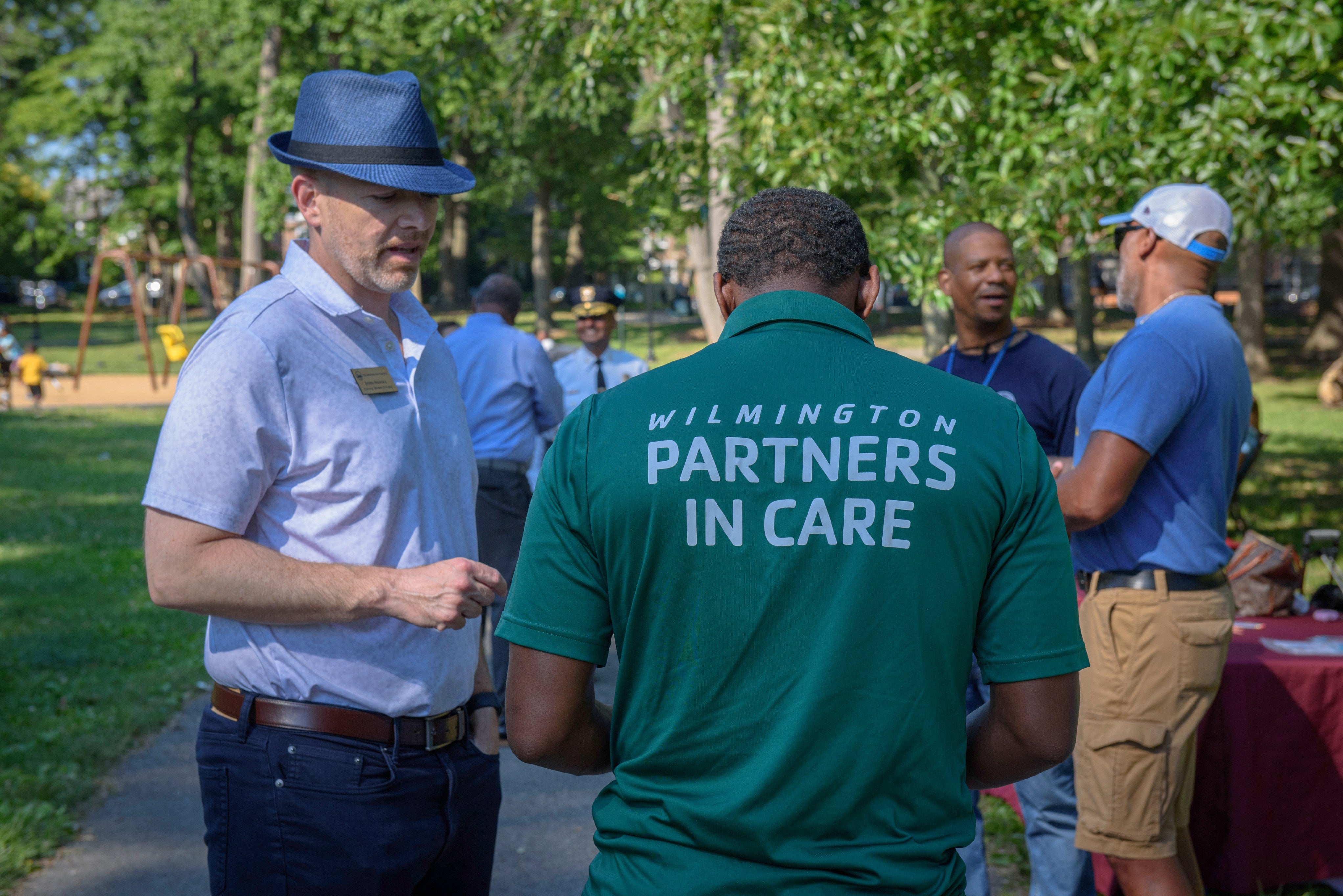 Wilmington City Councilman James Spadaro speaks with a member of Wilmington's Partners in Care program