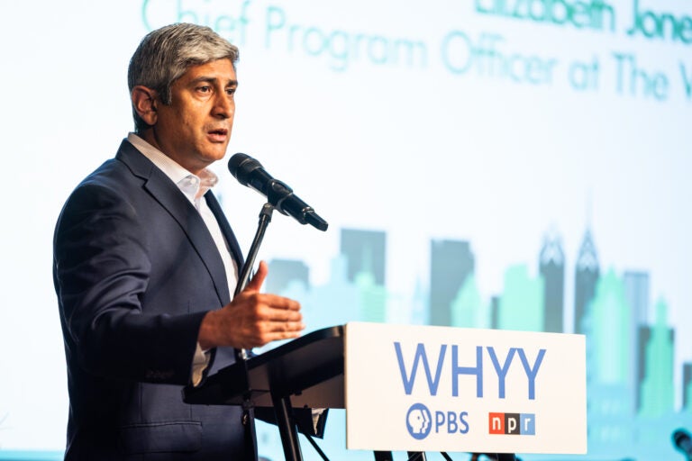 Bill Marrazzo speaking at a podium on stage