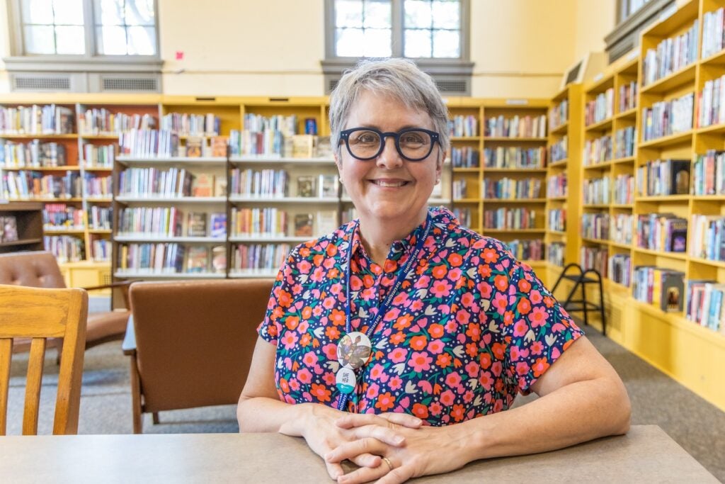 Catherine Collins posing for a photo inside the library