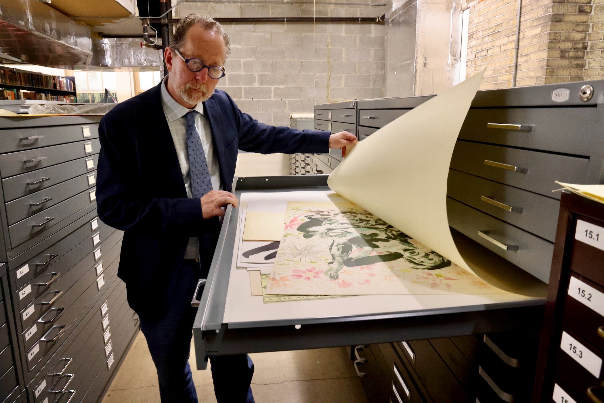 Historical Society of Pennsylvania CEO David Brigham looks at a print