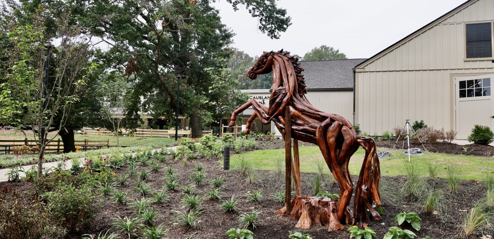 2025 09 24-e lee-philadelphia fairmount park chamounix stables-new arena sculpture A sculpture of a horse in a garden